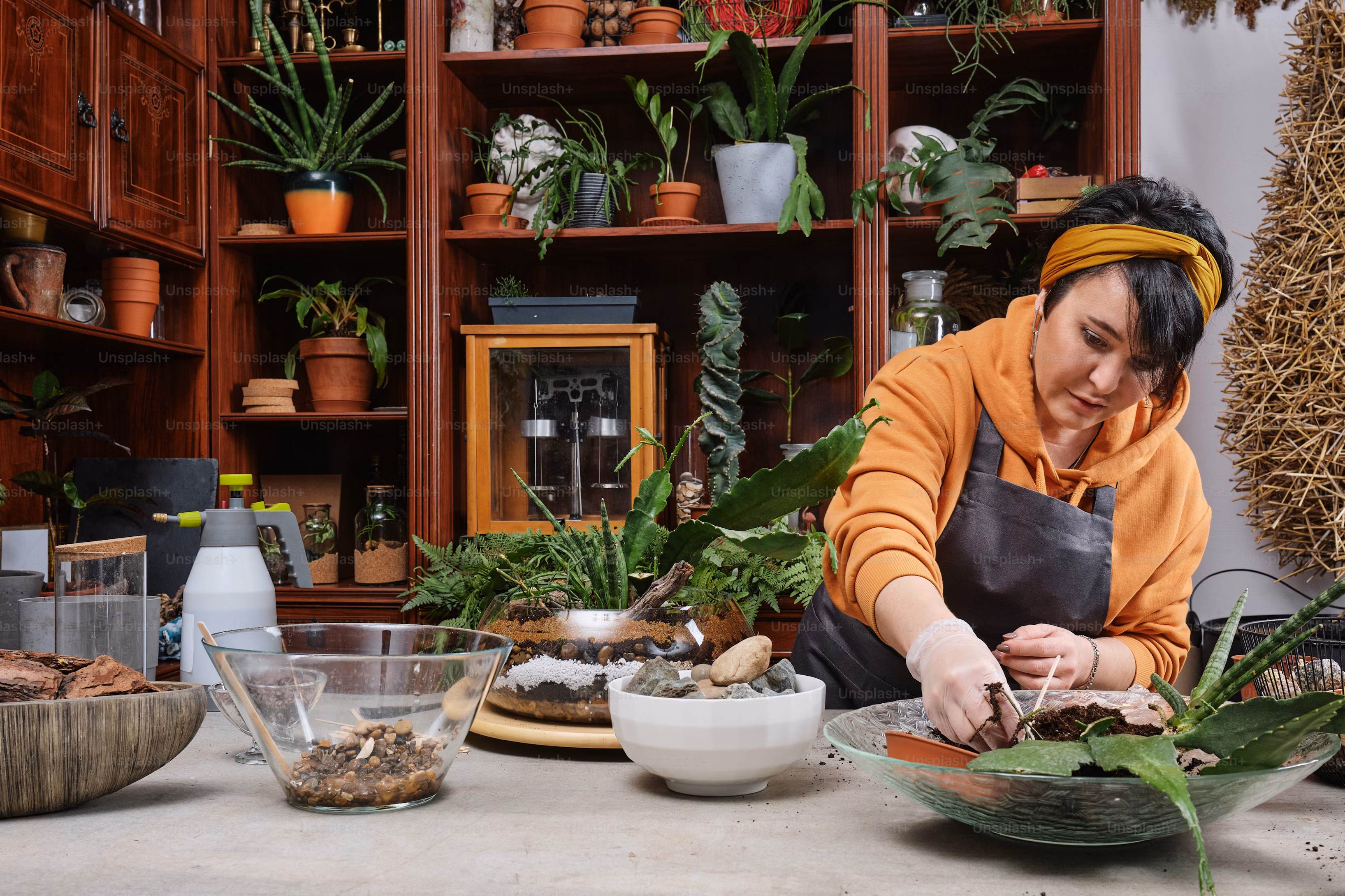 a woman in an orange shirt is preparing food